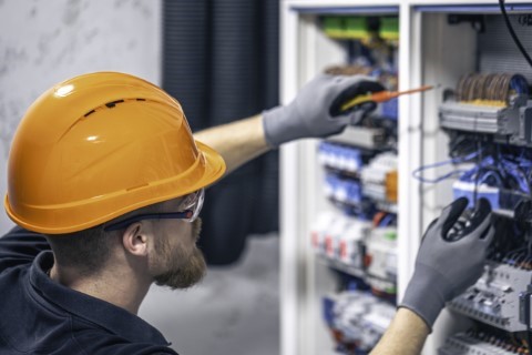 male-electrician-working-switchboard-with-fuses (Phone) (Phone)