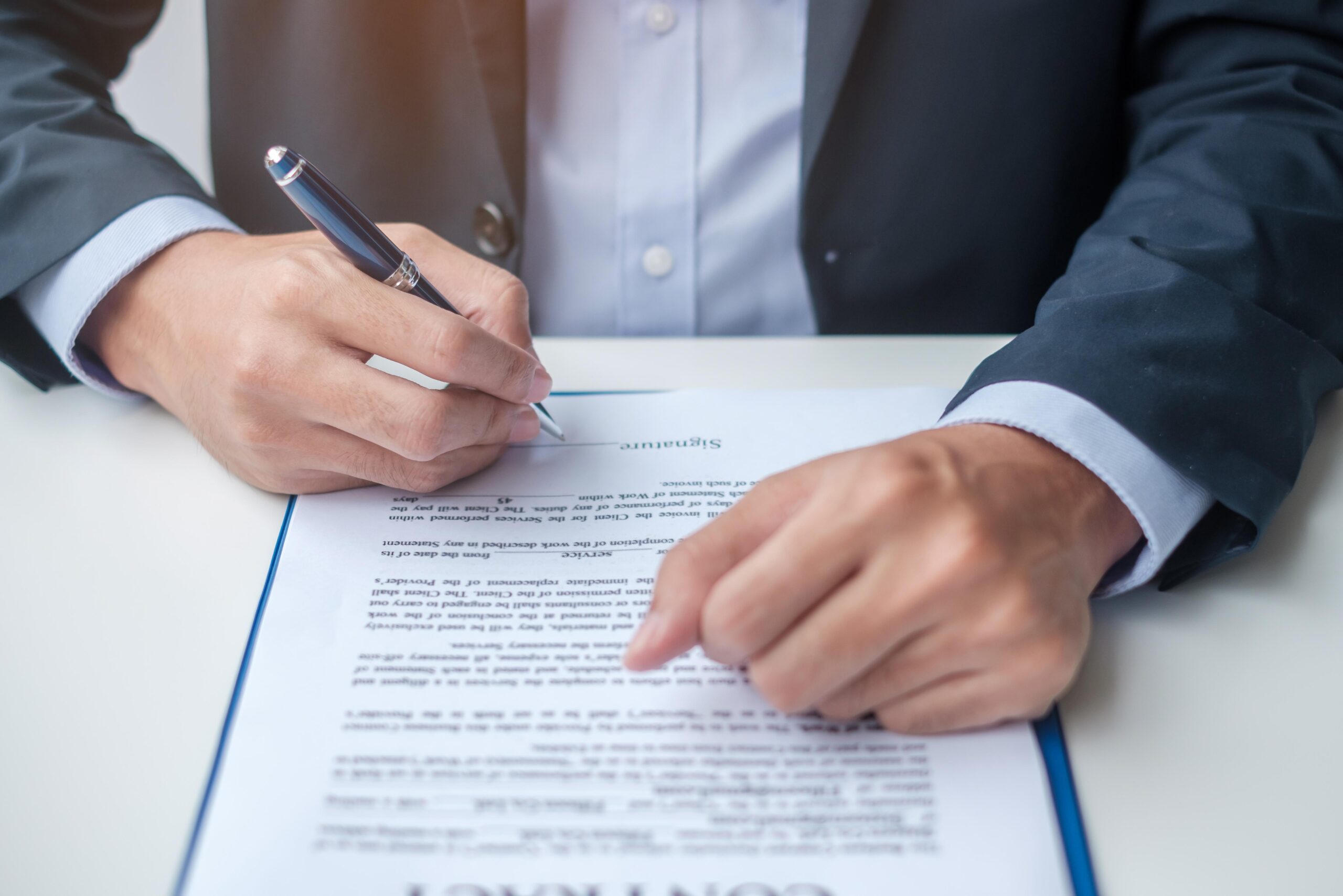 businessman-signing-on-contract-documents-after-reading-man-holding-pen-and-approve-on-business-report-contract-agreement-partnership-and-deal-concepts-free-photo (wecompress.com)