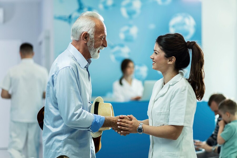 happy-senior-man-handshaking-with-female-doctor-while-talking-lobby-clinic_637285-460 (6)