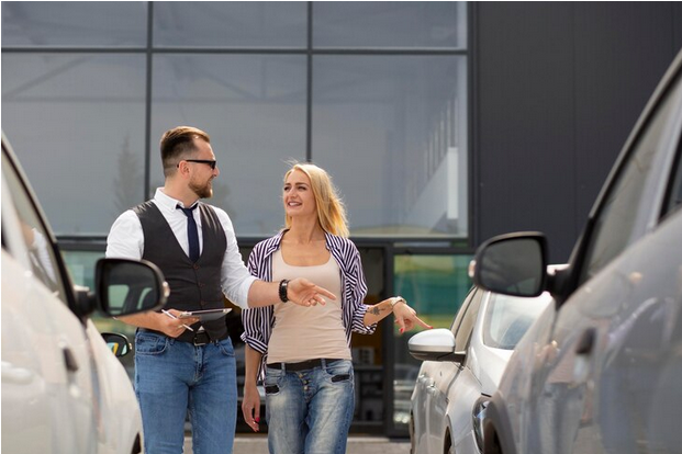 Screenshot 2024-10-26 at 10-08-07 Free Photo Happy customer in car dealership with seller