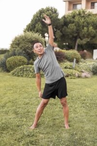 full-shot-smiley-man-exercising-nature-min