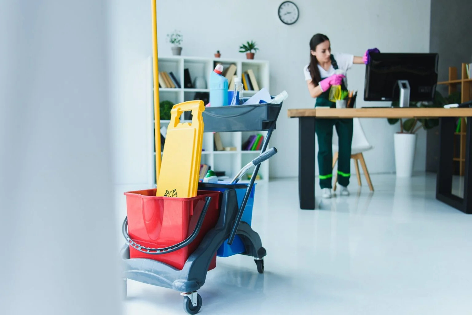 young-female-janitor-cleaning-office-with-various-cleaning-equipment-1536x1025 (2)