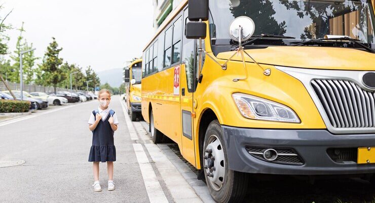 back-school-little-girl-with-blue-backpack-from-elementary-school-outdoor_1048944-11612060