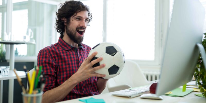 male-graphic-designer-cheering-while-watching-football-match (1)