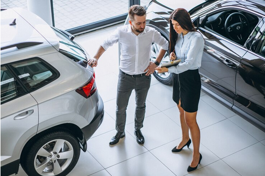 Screenshot 2024-12-03 at 15-52-35 Free Photo Salesman and woman looking for a car in a car showroom