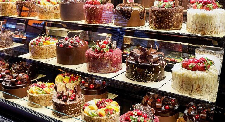 assorted-fancy-cakes-shop-window-cafe_267929-725