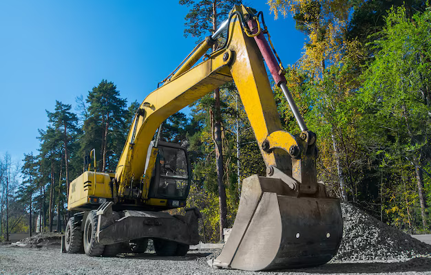 road-repair-asphalt-laying-yellow-wheeled-excavator_431724-3109.jpg (AVIF Image 626 × 416 pixels)