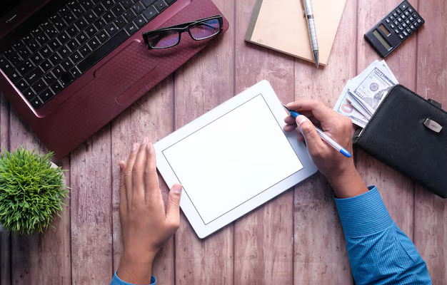 young-man-working-digital-tablet-with-laptop-notepad-table_260672-230.jpg (AVIF Image 626 × 417 pixels)