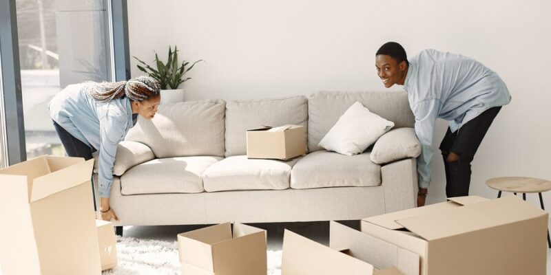 young-couple-moving-new-home-together-african-american-couple-with-cardboard-boxes_1157-40330