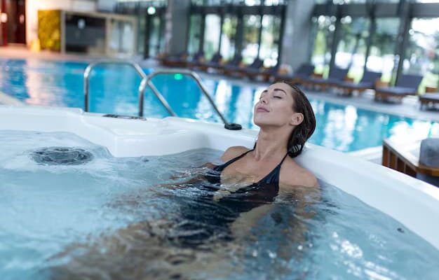 excited-female-enjoys-while-splashing-warm-water-spa-procedure-whirlpool_1212-4410