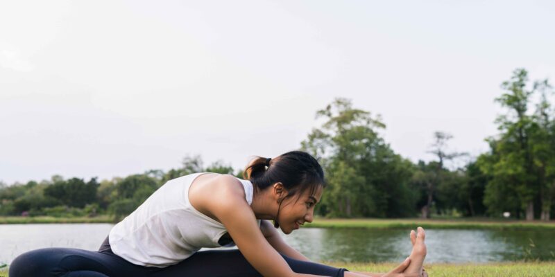 young-asian-woman-yoga-outdoors-keep-calm-meditates-while-practicing-yoga (1)-min (1)